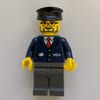 Train Worker, Blue Jacket with Train Logo, Black Hat, Beard and Glasses