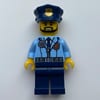 Policeman, Bright Light Blue Jacket with Zipper, Radio, Badge, and Tie, Dark Blue Legs, Dark Blue Police Hat with Badge, Beard