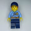 Policewoman, Bright Light Blue Shirt, Dark Blue Legs, Dark Blue Cap with Ponytail